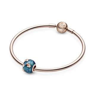 Talisman strălucitor cu valuri oceanice și pește