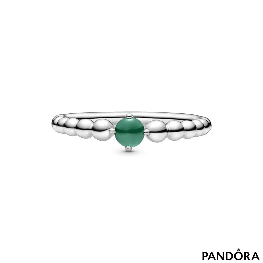 Кольцо из бусинок с зеленым камнем 
