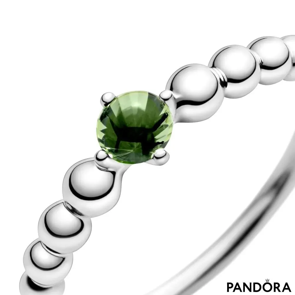 Кольцо из бусинок со светло-зеленым камнем 