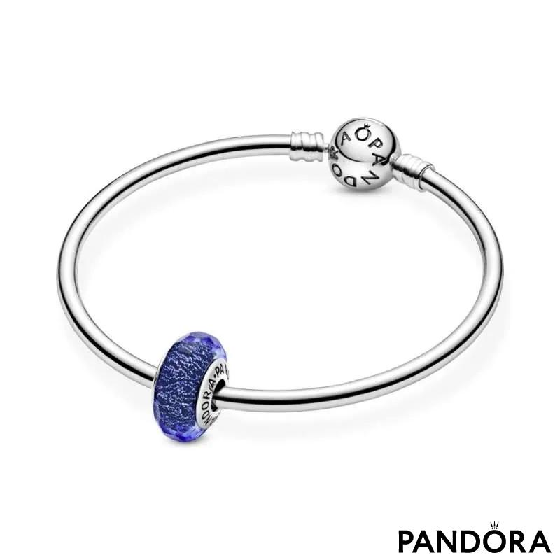 Abstract silver charm with faceted iridescent blue Murano glass